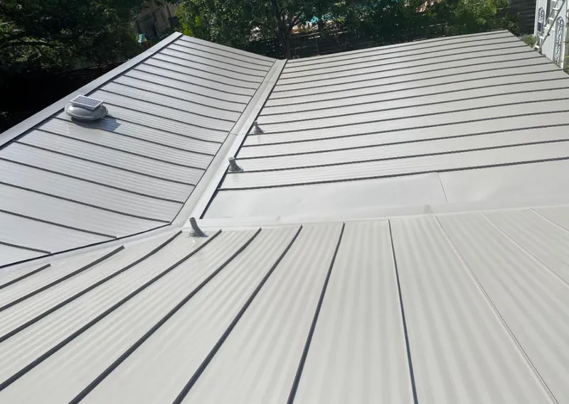 Solar attic fan installed on a metal roof for Roof Ventilation in Marietta